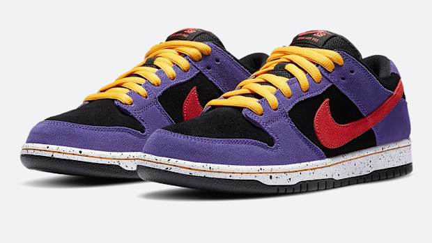 Purple, black, red, and yellow Nike Dunk shoes.